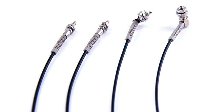 REDIS fiber optic sensor cables with assorted connector heads.